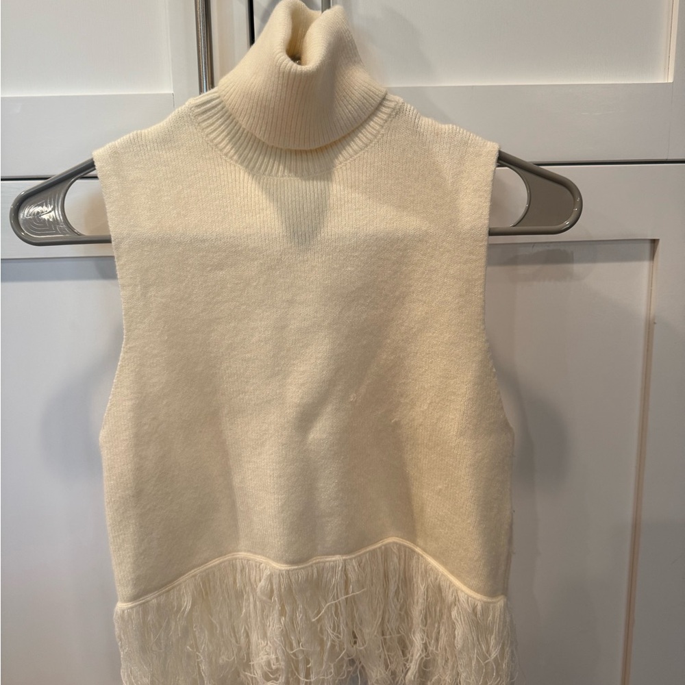 Elegant Cream Turtleneck Sweater with Fringe